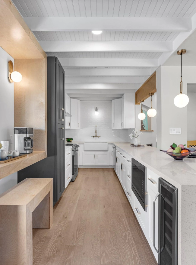 white kitchen with wood flooring